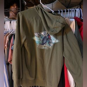 Green hoodie, ocean cost